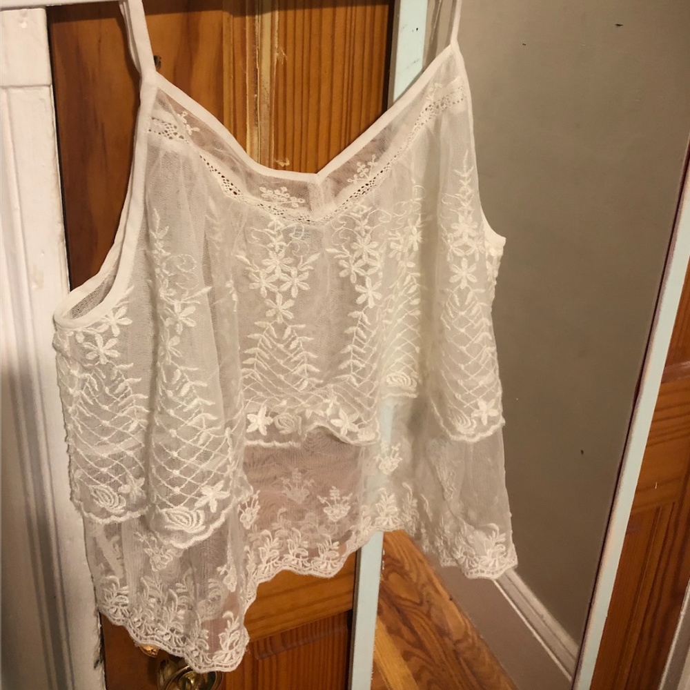 See through cream colored tank